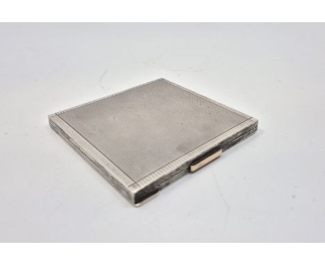 A silver cased engine turned compact,&nbsp;London 1941, 8.5cm x 8.3cm, (some damage to interior mirror). (gross weight 175.1g