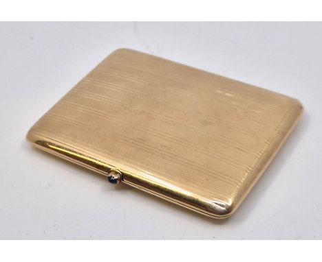 A French 14ct. gold cigarette case, with banded engine turned decoration to sides and cabochon sapphire set sprung latch, 8.7