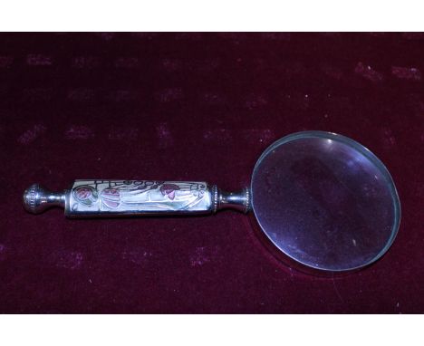 A vintage large magnifying glass with enamel inlay on handle 