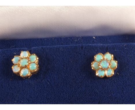 A pair of 9ct Gold Opal set stud earrings of flower form