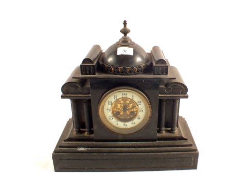 A Victorian black marble striking mantel clock