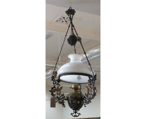 An Iron and Brass hanging oil lamp with bird, bow and arrow decoration