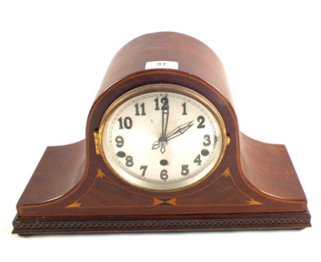 An Edwardian Mahogany striking mantel clock