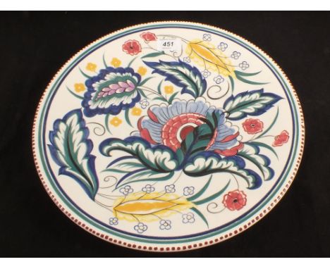 A Poole floral charger signed J.D.Dowding