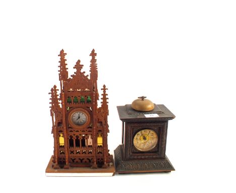 A Junghams alarm clock in carved Oak case plus a fretwork mantel clock