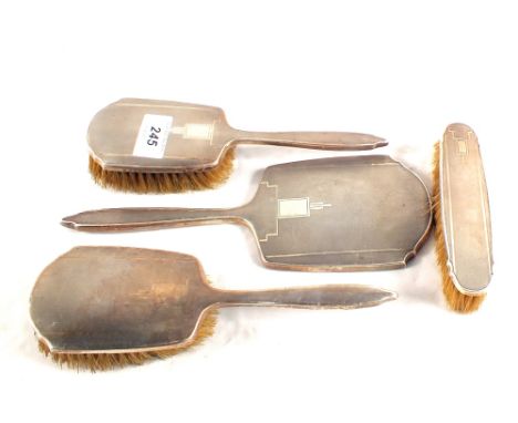 A Silver four piece engine turned brush and mirror set