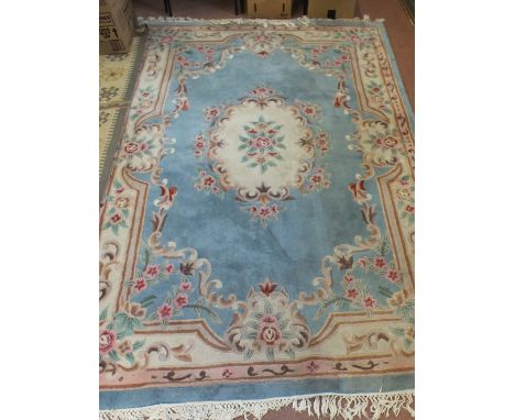 A Chinese blue ground floral carpet, 102" x 66"