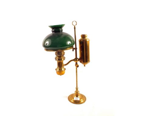 A Brass students oil lamp with green glass shade