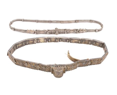 A Russian silver belt: of panelled construction with niello enamel decoration, together with another white metal belt.