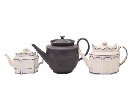 An early 19th century black basalt punch pot and cover and two Castleford-type teapots and covers: the circular punch pot wit