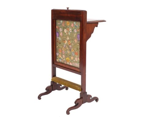 An Edwardian mahogany and silkwork firescreen, early 20th century,: of rectangular form, the front inset with a needlework pa