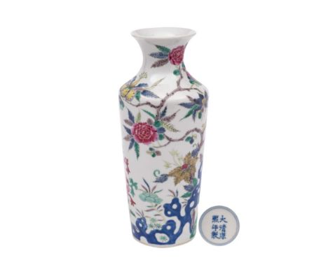 A Chinese porcelain famille rose vase: of shouldered cylindrical form with flaring neck enamelled with prunus, peony, chrysan