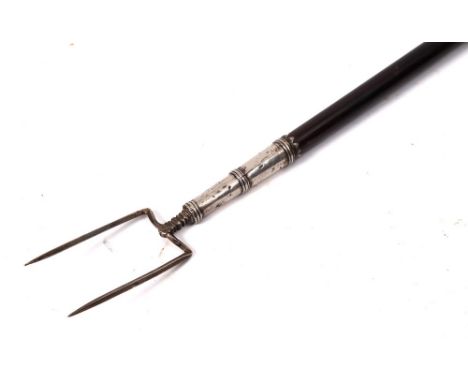 A late 18th Century silver, unhallmarked, mounted twin pronged toasting fork: with ebonised handle and ball and ring terminal