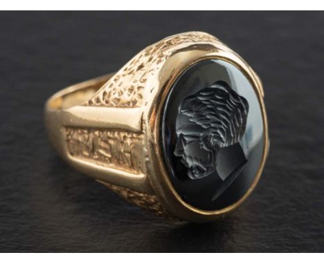 A 9ct gold, hematite signet ring,: depicting profile of a gentleman, with hallmarks for Birmingham, 1978, length of ring head