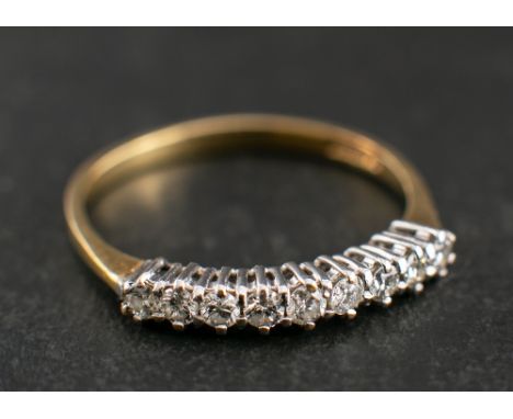 A 18ct gold and round, brilliant-cut diamond half-eternity ring,: total estimated diamond weight ca. 0.25ct, with import mark