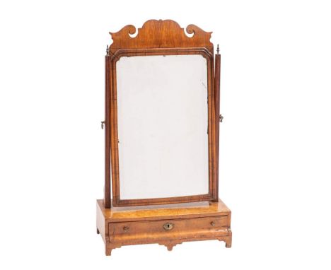 A George II walnut dressing table mirror, circa 1740,: the angle adjustable bevelled rectangular plate with fretwork cresting