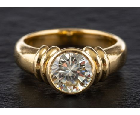 A round, brilliant-cut diamond single-stone ring,: estimated diamond weight ca. 1.30ct, tinted colour, VVS1-2 clarity, stampe