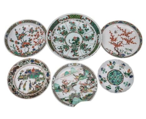 A group of six Chinese famille verte dishes and chargers, Kangxi: variously painted with figures, blossom and flowering shrub