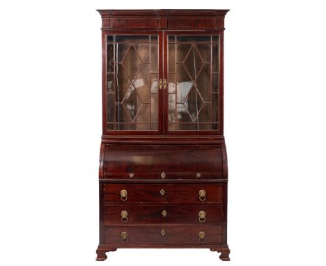 A mahogany and glazed secretaire bookcase, possibly French, circa 1830,: the upper section with moulded cornice and plain fri