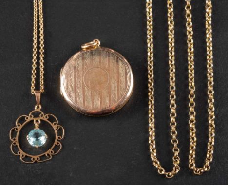 Two early 20th century pendants,: including a circular locket pendant with engine-turned decoration, with partial hallmarks, 