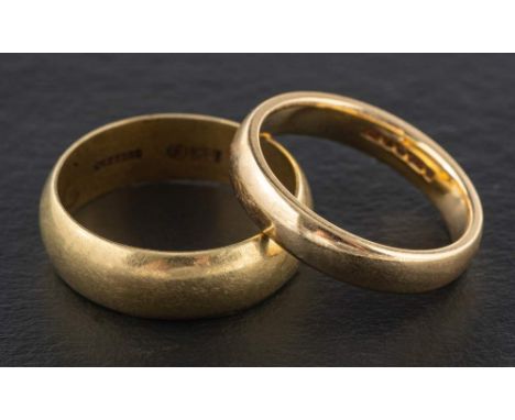 Two band rings,: including a 9ct gold ring with hallmarks for Sheffield, 1996 and a ring stamped '585' with inscription to in