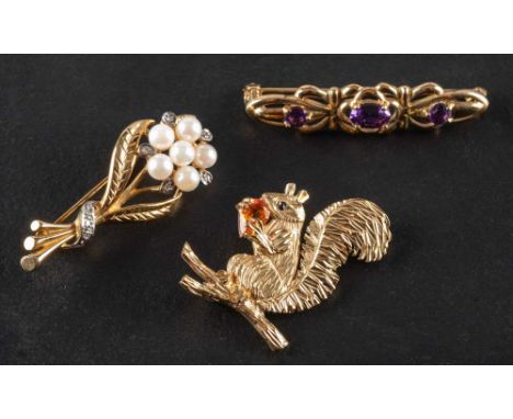 Three gemset brooches,: including a 9ct gold squirrel brooch probably holding a citrine; a 9ct gold cultured pearl and diamon