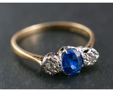 A sapphire and old-cut diamond ring, three-stone ring,: total estimated diamond weight ca. 0.08ct, calculated sapphire weight