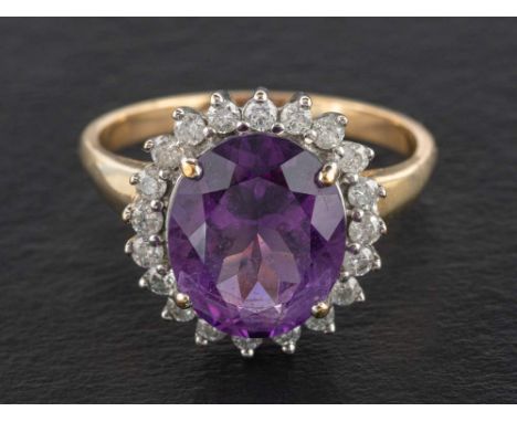 A 9ct gold amethyst and round, brilliant-cut diamond cluster ring,: estimated amethyst weight ca. 4.40cts, estimated total di