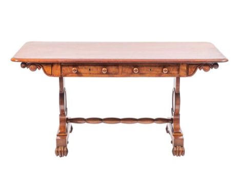 A Regency mahogany library table, early 19th century,: the rectangular top with rounded corners and moulded edges; above twin