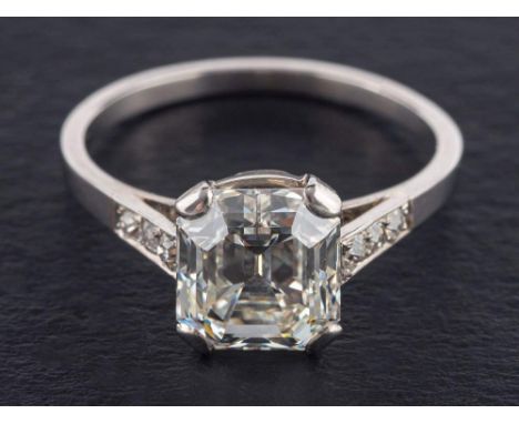 An octagonal step-cut diamond ring,: estimated weight of principal diamond ca. 2.60cts, H-I colour, VVS1-2 clarity, estimated