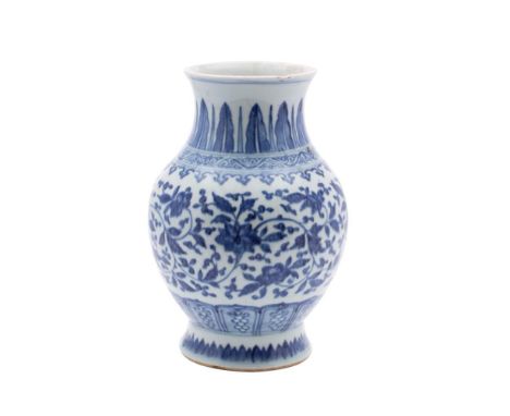 A Chinese blue and white baluster vase: painted in Ming style with scrolling lotus and peony between spearhead and lappet bor