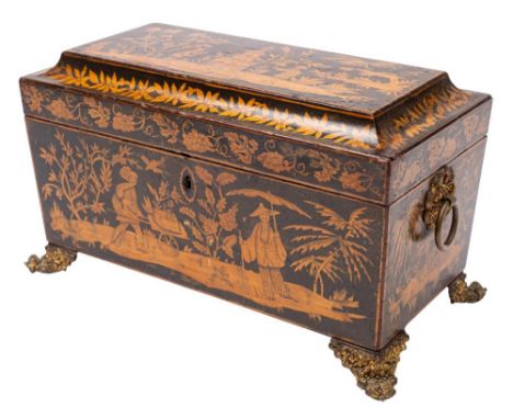 An early 19th century penwork tea caddy: of sarcophagus outline, the shallow domed hinged lid with chinoiserie decoration enc