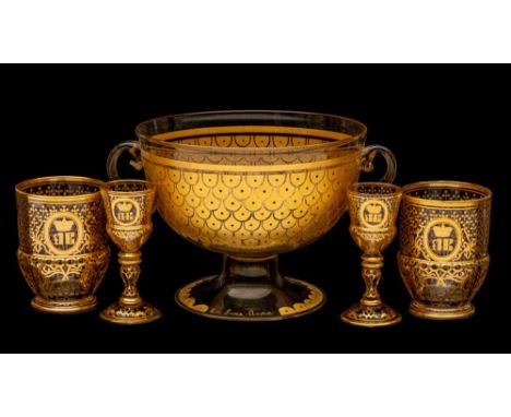 A Continental glass two-handled bowl, two beakers and two matching tots: the bowl decorated in gilt with a scale design, the 