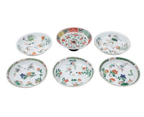 A set of three Chinese famille verte saucer dishes and three similar, one in the wucai palette with metal foot: all painted w