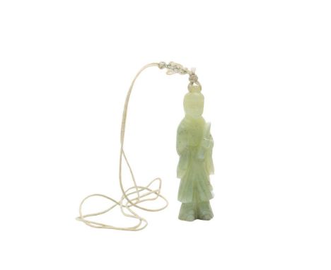 A Chinese carved celadon jade pendant: in the form of Guanyin holding a scroll, 7cm.
