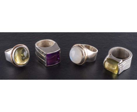 Four gemset rings,: including moonstone, amethyst and peridot, ring sizes O-R, total weight ca. 99.6gms (4). 'The property of