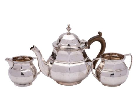 A George V silver three-piece silver tea service, maker's mark worn, Chester 1915: of bulbous octagonal outline, raised on a 