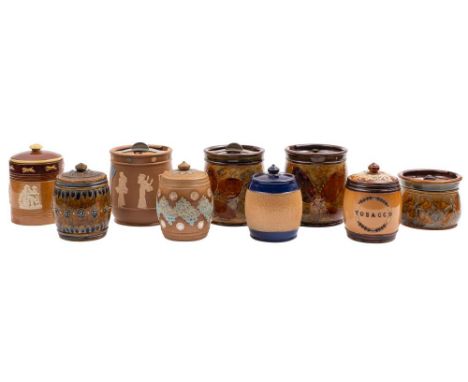 Nine Doulton stoneware tobacco jars: comprising three Natural Foliage Ware examples, two Silicone, one sprigged with Toping s