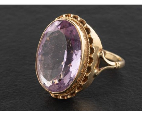 A 9ct gold, mixed-cut amethyst, single-stone ring,: estimated amethyst weight ca. 13cts, with hallmarks for London, 1975, len