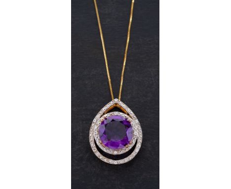 A 9ct gold amethyst and white paste pendant,: calculated weight of amethyst ca. 6cts, with hallmarks for Birmingham, 2012, le