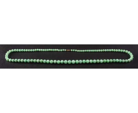 A graduated jade bead necklace,: diameter of beads ca. 4.4-9.7mms, total length ca. 70cm.