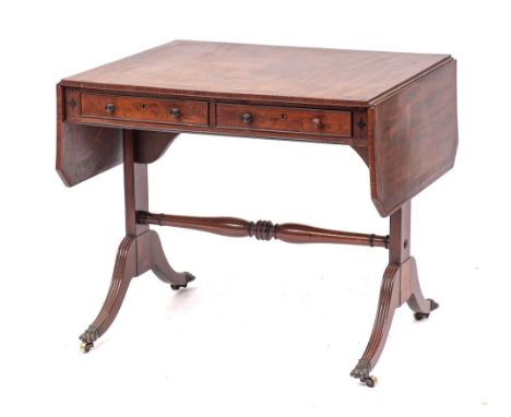 A Regency mahogany and crossbanded sofa table, possibly Scottish, circa 1815,: the top with ebony stringing to inset dots, th