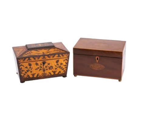 An early 19th Century mahogany and inlaid tea caddy: of rectangular outline, the hinged lid enclosing two lidded compartments