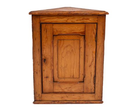 A George III pine hanging corner cupboard, late 18th century,: with panel door enclosing a shelf within; 51cm high, 41cm wide