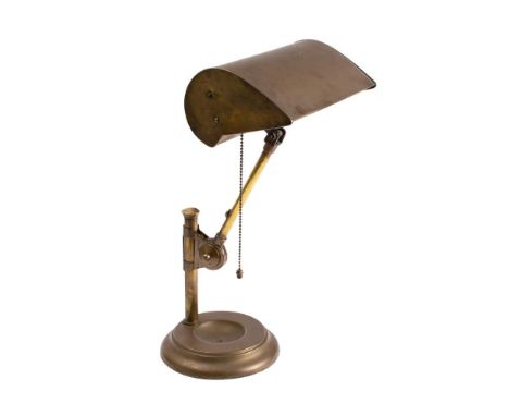 A 1920's GEC adjustable table lamp: with hooded shade on an adjustable column and weighted circular base, 37cm high.