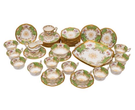 A Coalport part tea service: painted and printed with floral sprays reserved on a gilt and apple green ground, printed marks,