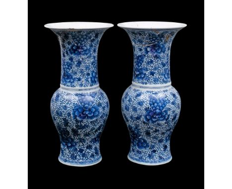 A pair of Chinese blue and white yen yen vases: each painted overall with large peony blooms and scrolling foliage and tendri