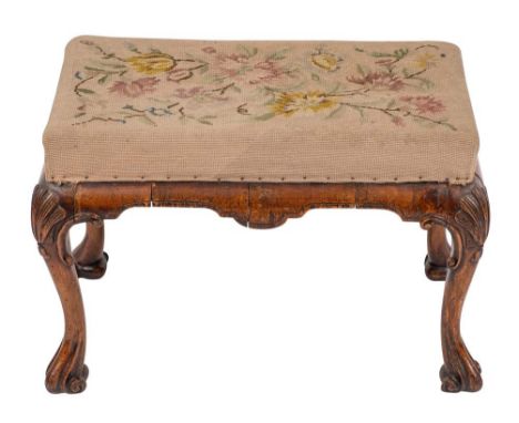 A walnut and needlework tapestry upholstered stool in Queen Anne taste, 19th century,: the rectangular seat above cushion mou