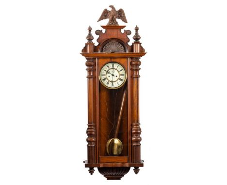 A Vienna-style wall regulator: the eight-day duration weight-driven movement striking the hours and half-hours on a gong with