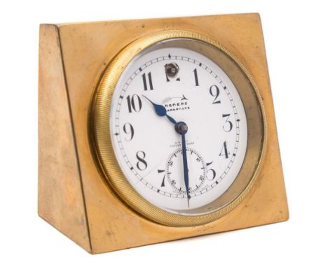 A brass mounted timepiece: the white enamel round dial set aslant and having black Arabic hour numerals, blued steel spade ha